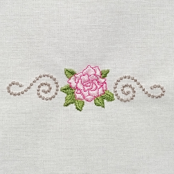 Delicate Rose for your linens. Vintage feel to them.